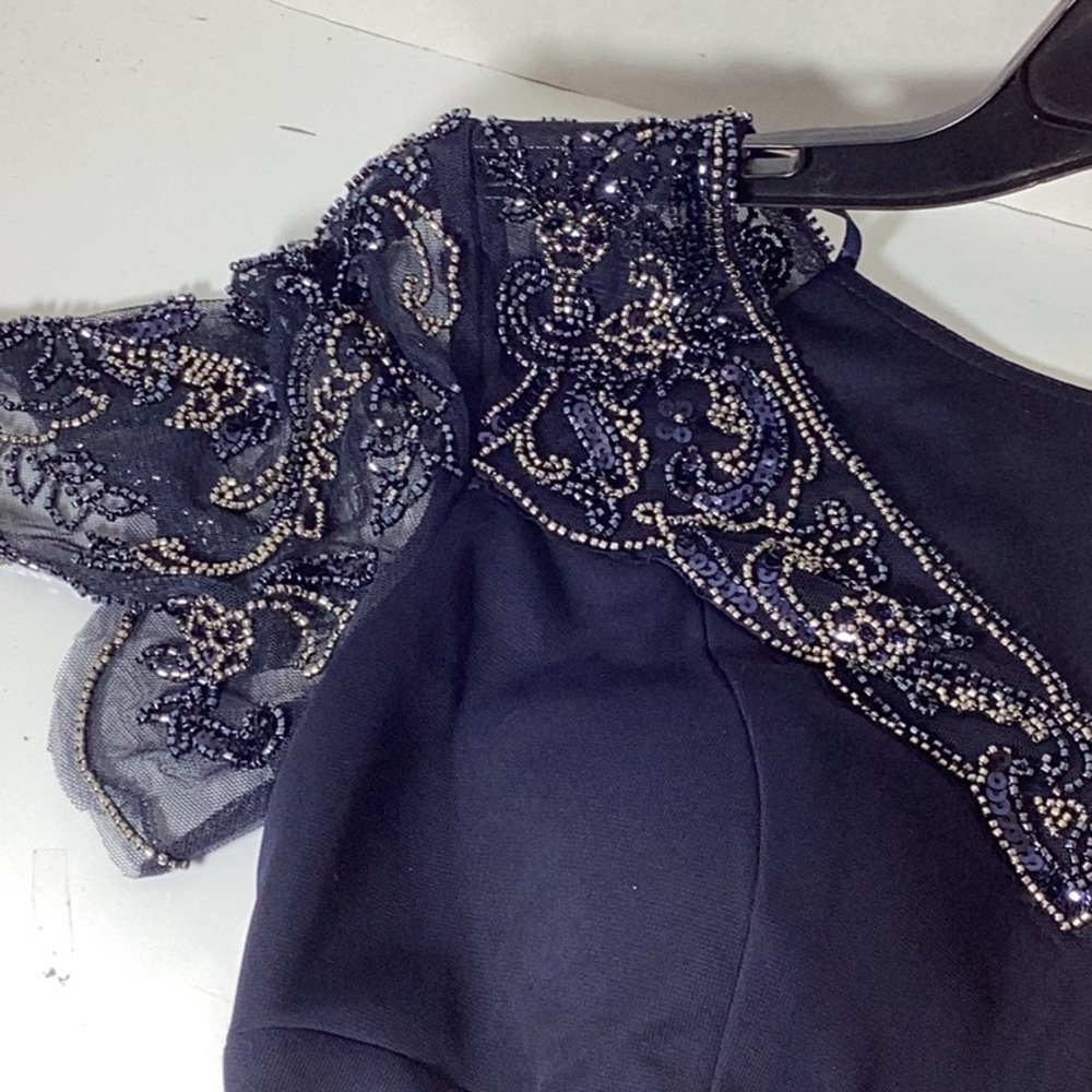 Xscape Petite Beaded Scallop-Sleeve Cascading Dress
Xscape
Current price: $269. - Picture 9 of 11